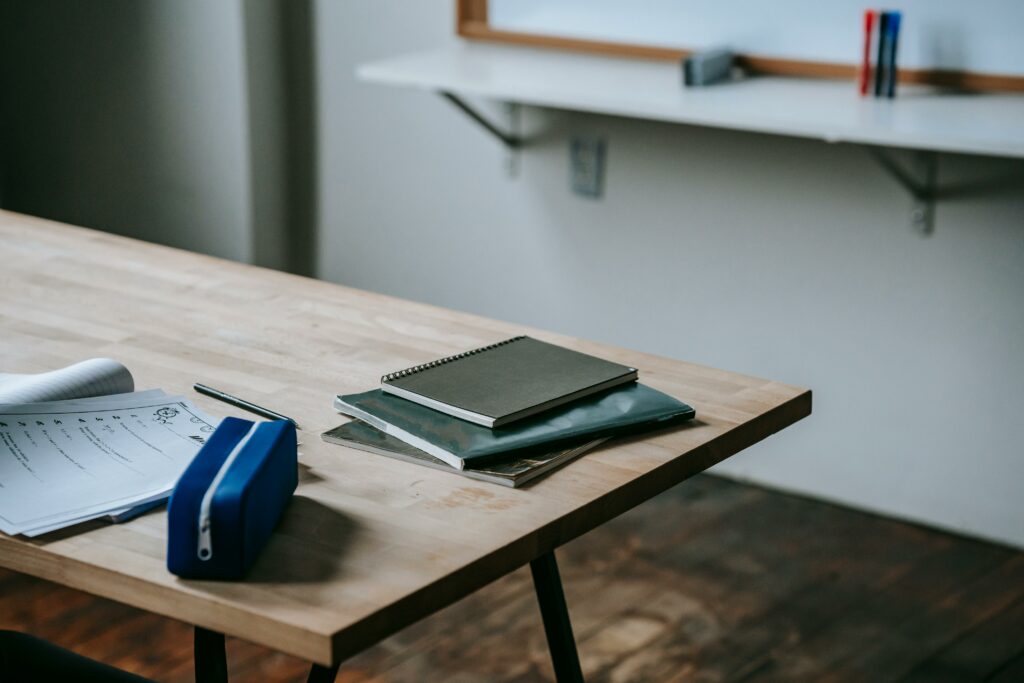 papers and notebooks on desk